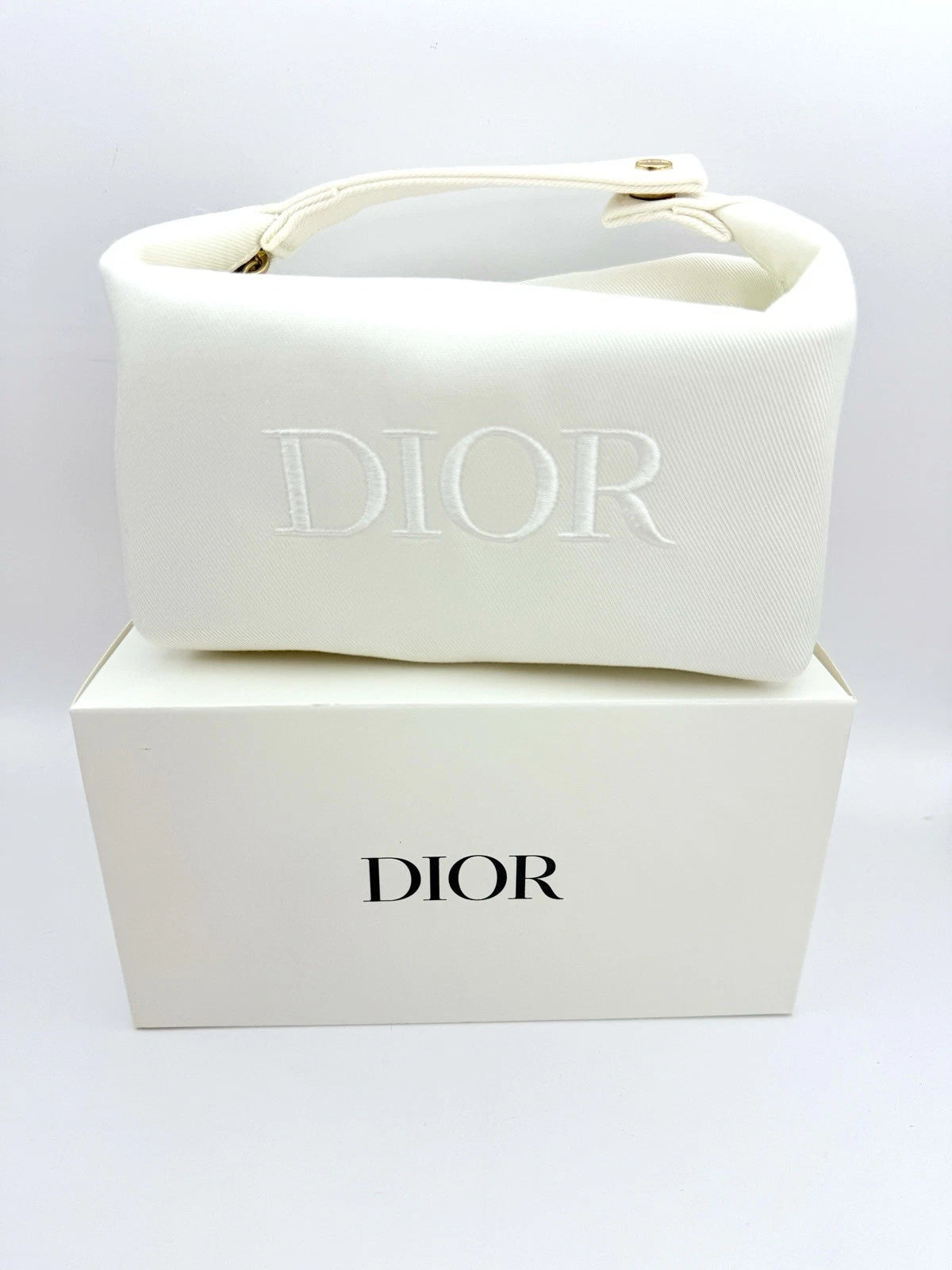Dior Dumpling-Shaped Embossed Logo Makeup Bag