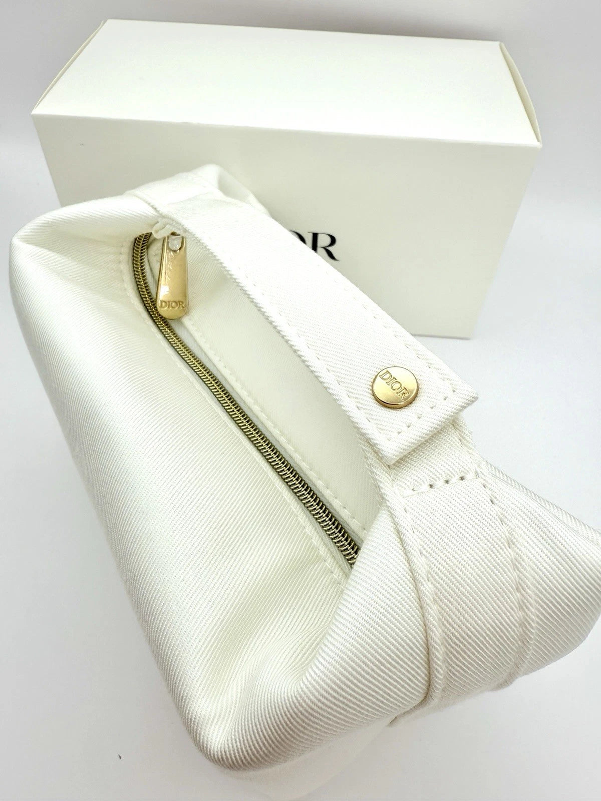 Dior Dumpling-Shaped Embossed Logo Makeup Bag